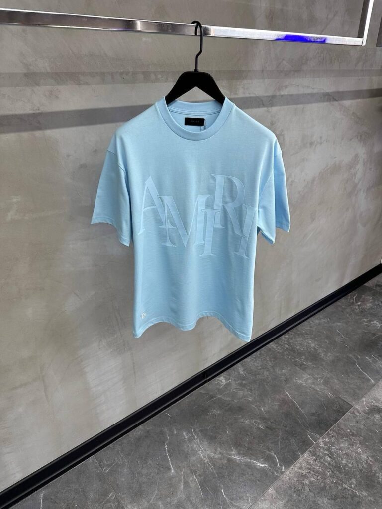 Sky blue amiri staggered logo-appliqué tee